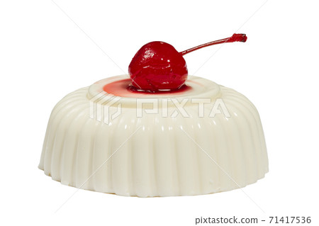 dandelion pannacotta decorated with sweet cherries with syrup, on white background 71417536