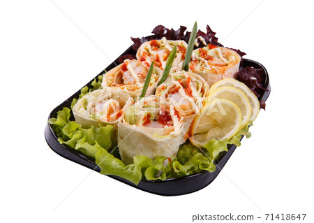 Thai wraps with crosses in a plastic plate, on a white background 71418647