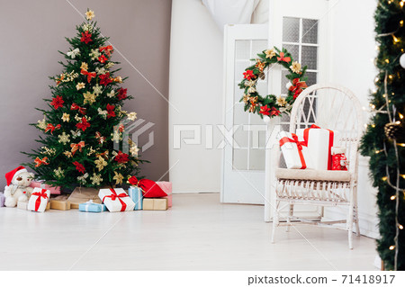 Christmas tree pine with new year gifts holiday red decoration decor gray background 71418917