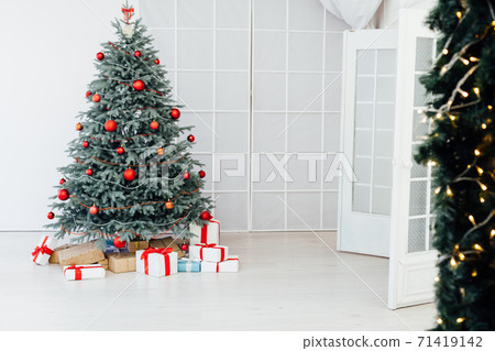 Christmas tree blue pine with gifts interior new year 71419142