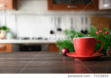 Wooden tabletop with red cup of coffee Wooden tabletop with red cup of coffee 71419659