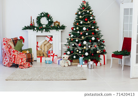 Christmas tree with fireplace presents interior decor house new year Christmas tree with fireplace presents interior decor house new year 71420413