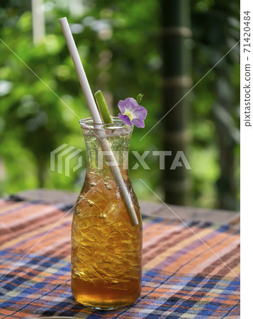 Close up ice tea bottle with blur background. 71420484