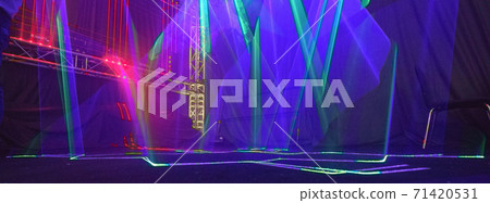 Futuristic bright lights on the stage. Lighting of stage spotlight. Natural high tech background. Photography is suitable for postcard design, greeting card background, template. Futuristic bright lights on the stage. Lighting of stage spotlight. Natural high tech background. Photography is suitable for postcard design, greeting card background, template. 71420531