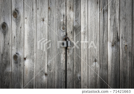 Locked brown old wooden fence Locked brown old wooden fence 71421663
