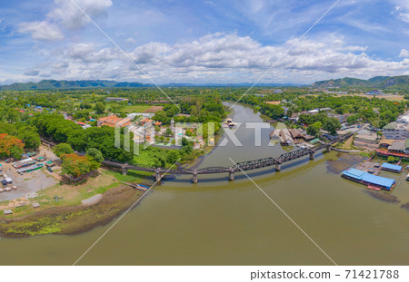Aerial view of River Kwai Bridge with train rail way with Chao Phraya River, Tha Ma Kham, Mueang Kanchanaburi District, Thailand. Aerial view of River Kwai Bridge with train rail way with Chao Phraya River, Tha Ma Kham, Mueang Kanchanaburi District, Thailand. 71421788