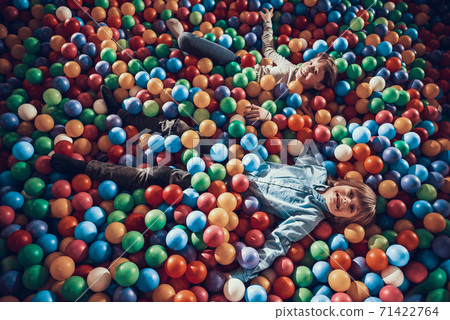 Children have fun while they lie in balls. Children have fun while they lie in balls. 71422764