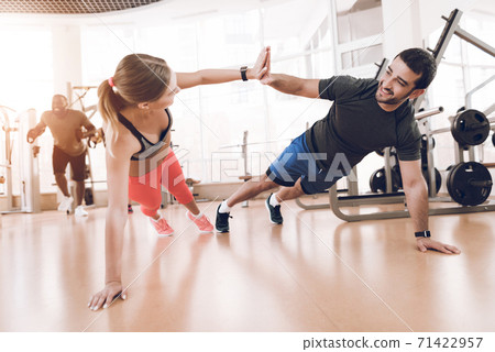 Girl doing exercises in a modern gym.  71422957