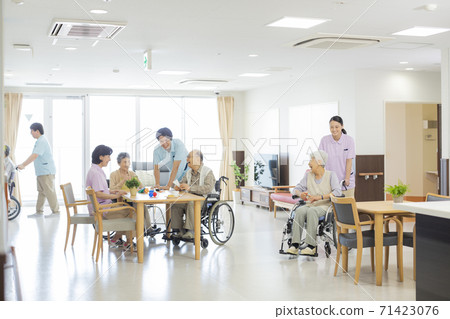 Wheelchair senior woman and caregiver nursing home 71423076