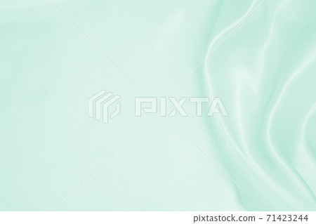 Smooth elegant green silk or satin luxury cloth texture as abstract background. Luxurious background design Smooth elegant green silk or satin luxury cloth texture as abstract background. Luxurious background design 71423244