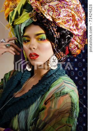 beauty bright woman with creative make up, many shawls on head like cubian, ethno look closeup beauty bright woman with creative make up, many shawls on head like cubian, ethno look closeup 71424828