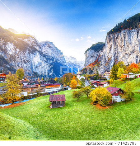 Amazing autumn landscape of touristic alpine village Lauterbrunnen Amazing autumn landscape of touristic alpine village Lauterbrunnen 71425795