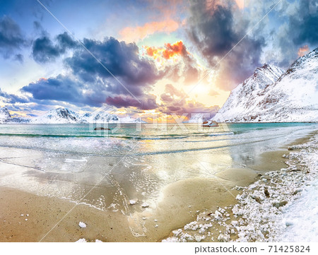 Fabulous winter scenery with Haukland beach during sunset and snowy  mountain peaks near Leknes. 71425824