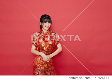 Asian woman wear Chinese dress with action Asian woman wear Chinese dress with action 71426147