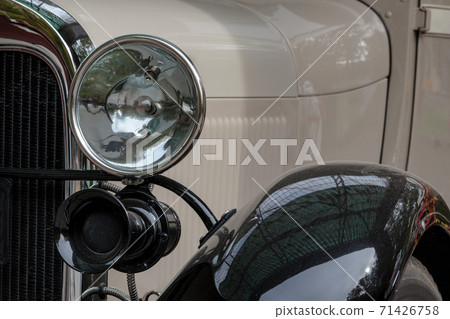 Old retro car lamp. Classic vintage vehicle front Old retro car lamp. Classic vintage vehicle front 71426758