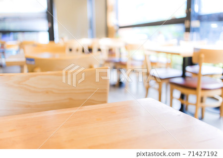 Modern interior of coffee shop with selective focusing  on wooden top table for montage product display 71427192