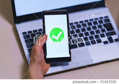 Smartphone authentication verify electronic approval [image of digitization of authentication] 71427226