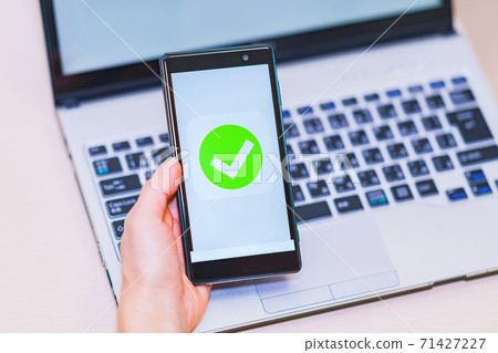 Smartphone authentication verify electronic approval [image of digitization of authentication] 71427227
