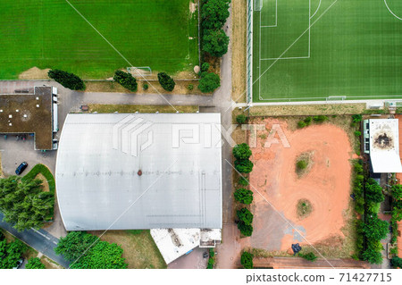 Vertical aerial view of a tennis hall  71427715