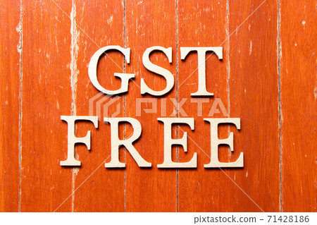 Alphabet letter in word GST (Abbreviation of Goods and Services Tax) free on old red color wood plate background Alphabet letter in word GST (Abbreviation of Goods and Services Tax) free on old red color wood plate background 71428186