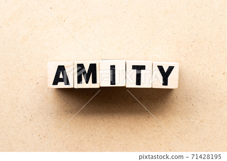 Letter block in word amity on wood background 71428195