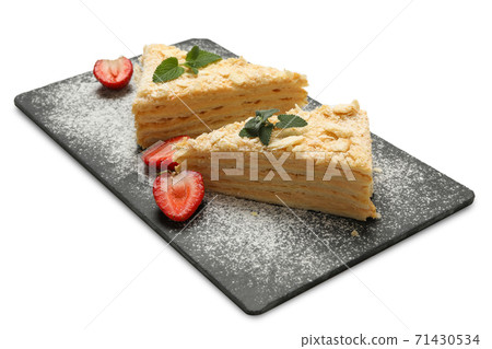 Board with pieces of Napoleon cake isolated on white background Board with pieces of Napoleon cake isolated on white background 71430534