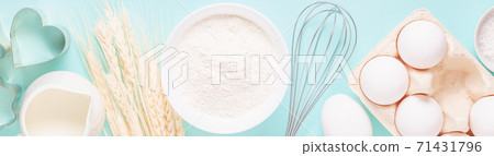 Ingredients for baking on light blue background. Ingredients for baking on light blue background. 71431796