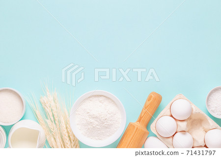 Ingredients for baking on light blue background. 71431797
