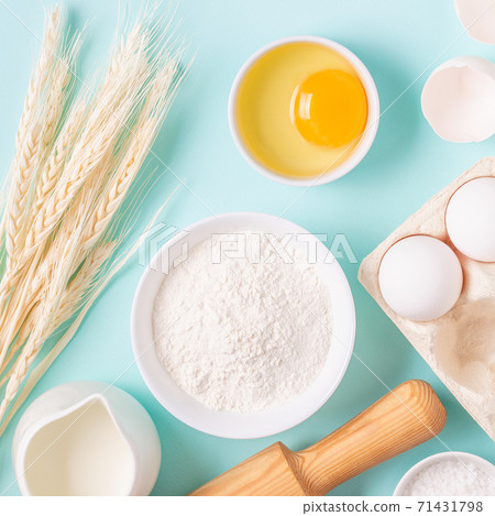 Ingredients for baking on light blue background. Ingredients for baking on light blue background. 71431798