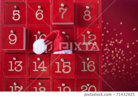 Red wooden Advent calendar with surprise for Christmas 71432925