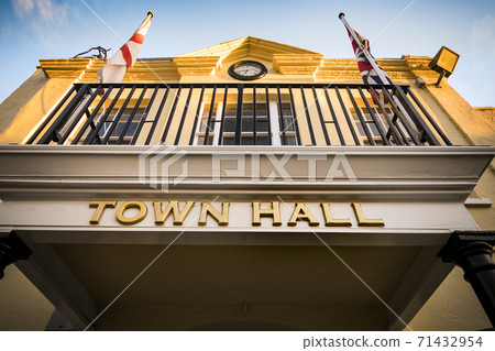 Looking up at town hall in early evening sunshine 71432954