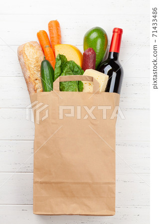 Different food in recycling paper bag 71433486