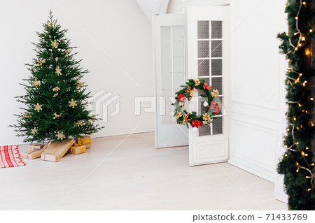 Christmas tree pine with gifts for the new year of the white room 2021 2022 71433769