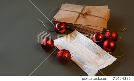 Christmas envelopes with a medical mask and red 71434385