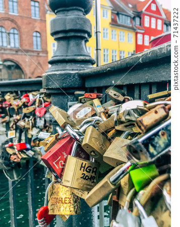 Many different love locks which closed on railing of the bridge. Nyhavn waterfront. Copenhagen, Denmark Many different love locks which closed on railing of the bridge. Nyhavn waterfront. Copenhagen, Denmark 71437222