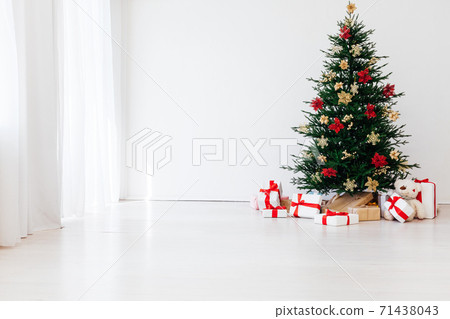 Christmas tree with decorations and gifts interior of the house new holiday white Christmas tree with decorations and gifts interior of the house new holiday white 71438043