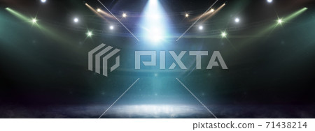 Hockey rink background. Searchlights. Stage for presentation illuminated by spotlights. Lights abstract background Hockey rink background. Searchlights. Stage for presentation illuminated by spotlights. Lights abstract background 71438214