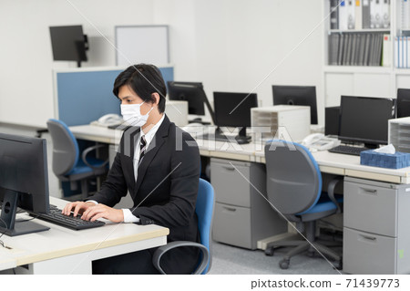 A businessman who works wearing a mask A businessman who works wearing a mask 71439773