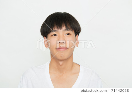 Young Man Smiling Happy on white 71442038