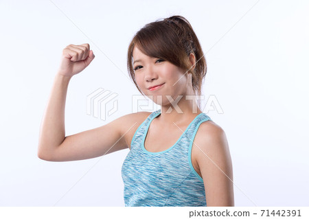 Young Asian girl make a fist . Concept of encourage, go for it. Isolated on white. Young Asian girl make a fist . Concept of encourage, go for it. Isolated on white. 71442391