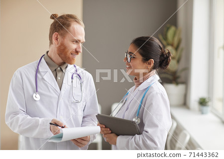 Two medical workers at hospital Two medical workers at hospital 71443362