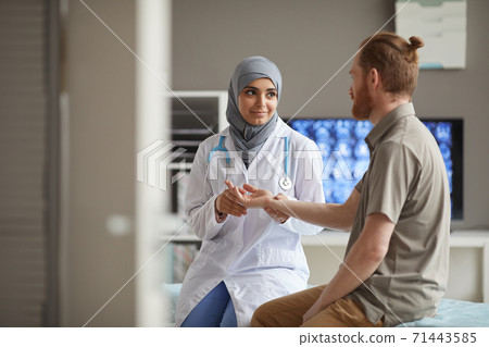 Patient at doctor's office Patient at doctor's office 71443585