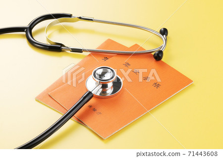 Pension notebook and stethoscope 71443608