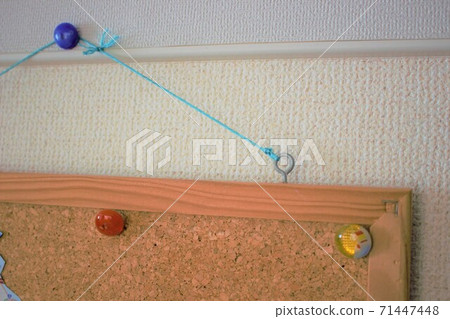 Cork board and thumbtack hung in the room Cork board and thumbtack hung in the room 71447448
