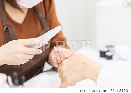 A woman giving a statement at a nail salon A woman giving a statement at a nail salon 71448110