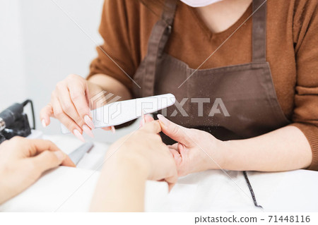 A woman giving a statement at a nail salon A woman giving a statement at a nail salon 71448116