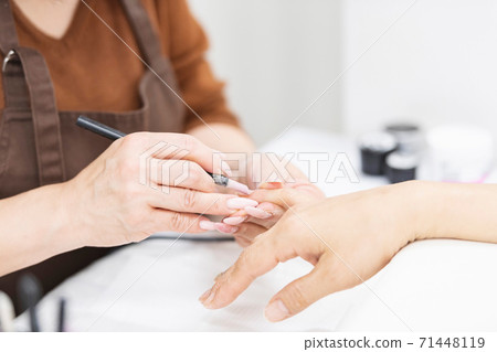 A woman giving a statement at a nail salon A woman giving a statement at a nail salon 71448119