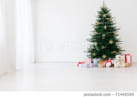 Christmas tree pine with gifts for the new year interior of the white room 71448589