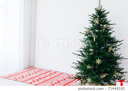 Christmas tree pine with gifts for the new year of the white room 2021 2022 71448591