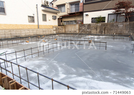 Construction site where foundation work for a new detached house has begun 71449063